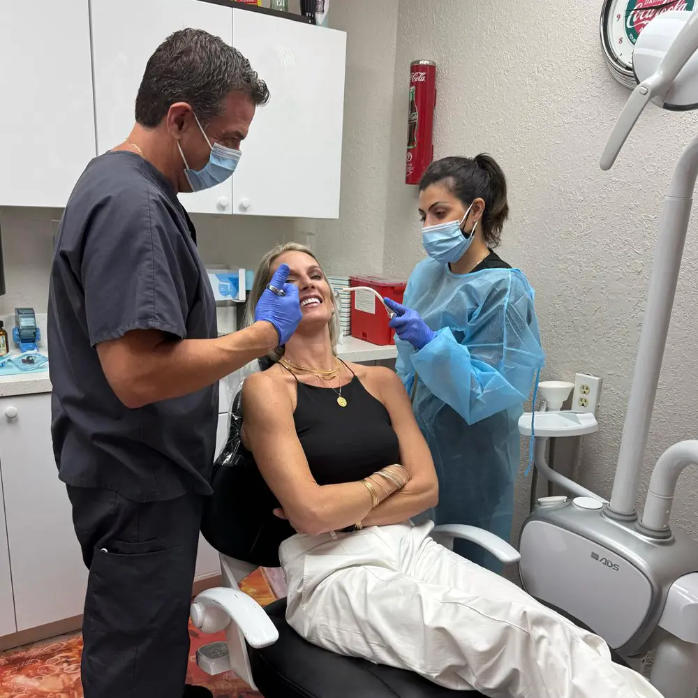 Home 14 Dr Lance Kamel doing a dental procedure at Kamel Dentistry Dentist in Plantation FL